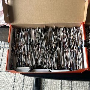 3 shoe boxes full of basketball and football cards with signatures and patches